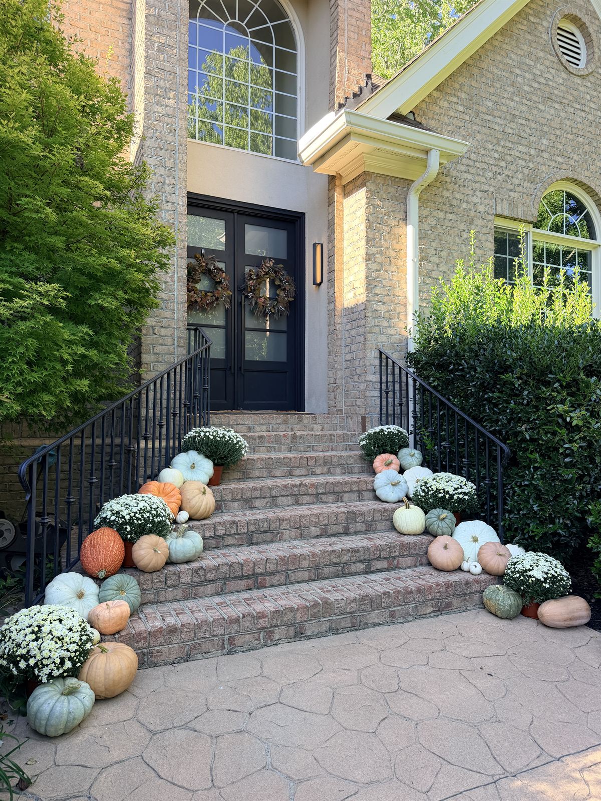 Grand brick staircase lined with white mums and blue, blush and white heirloom pumpkins, Wake County NC