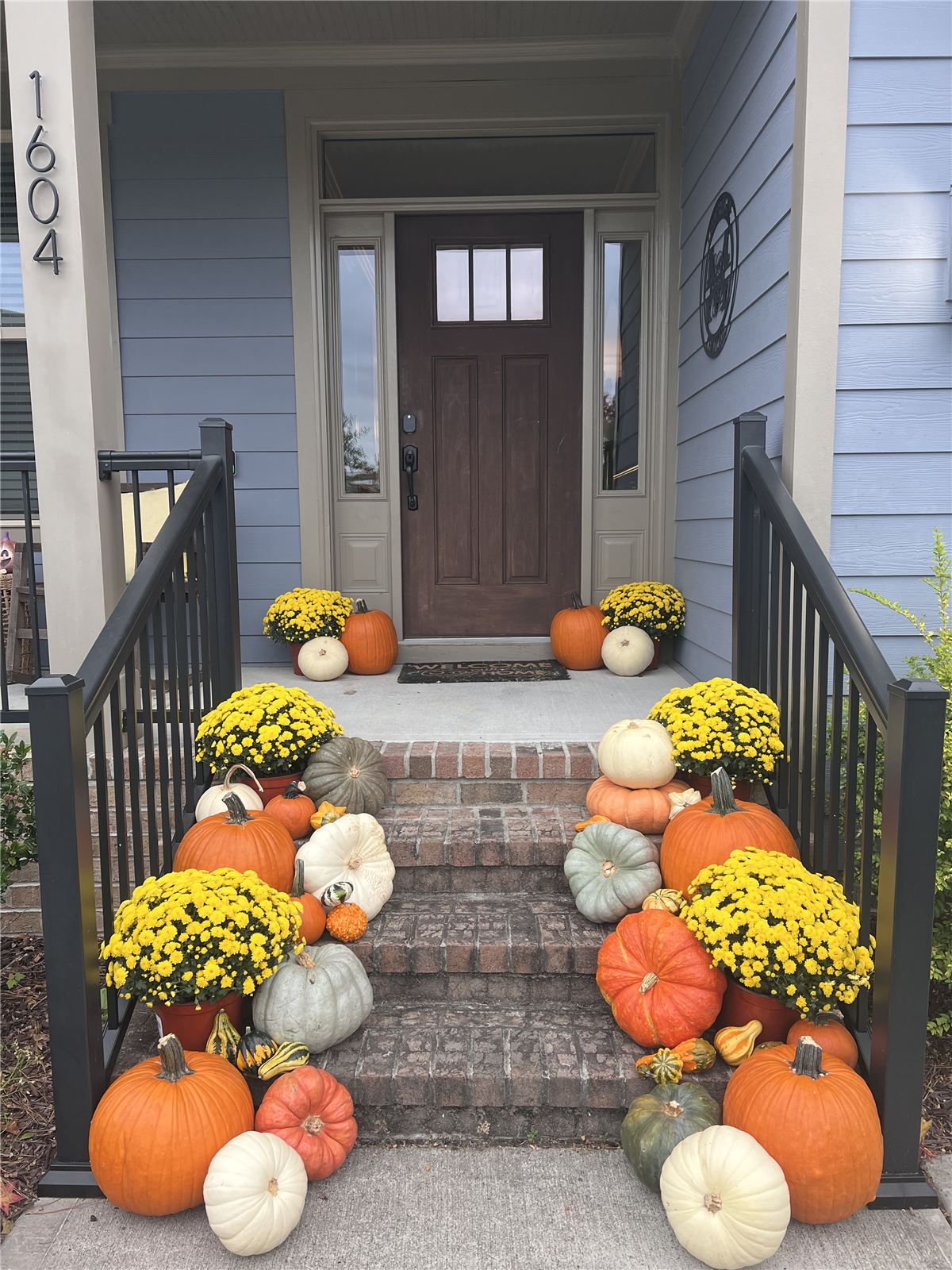 Professional fall porch styling with heirloom pumpkins, Cary NC area