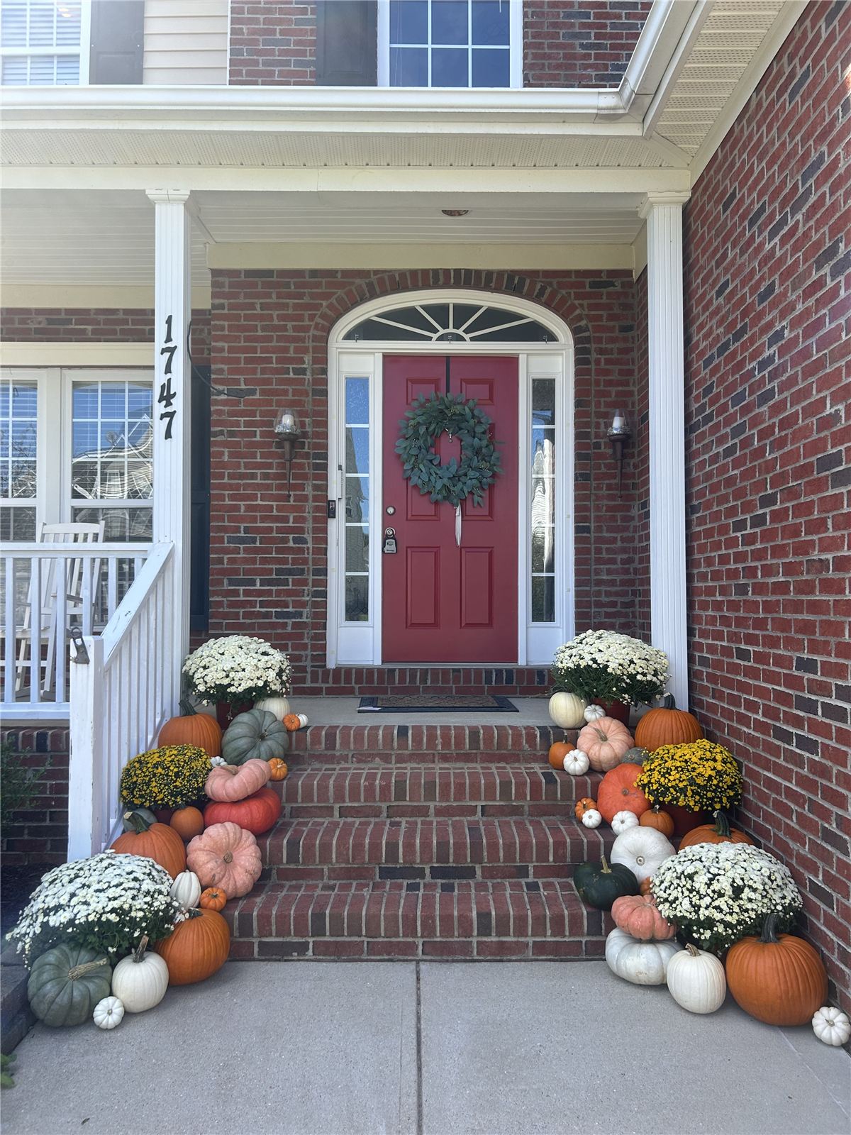 Autumn porch display with layered pumpkins, Wake County NC